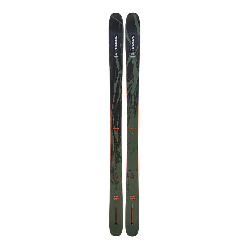Two skis with a green and black design on a white background
