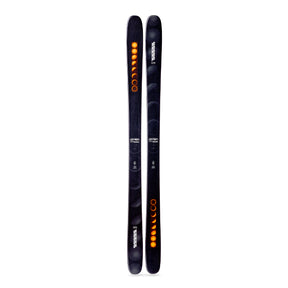 Two black skis with orange and white designs on a white background