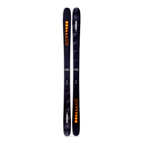 Two black skis with orange and white designs on a white background