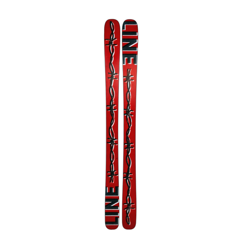 Red and black skis with barbed wire design on a white background