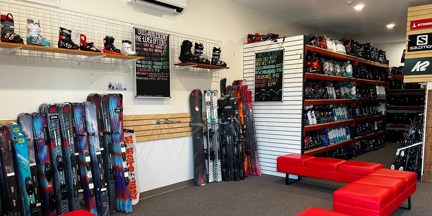 Interior of Proctor Ski & Board featuring skis, boots, and lease equipment